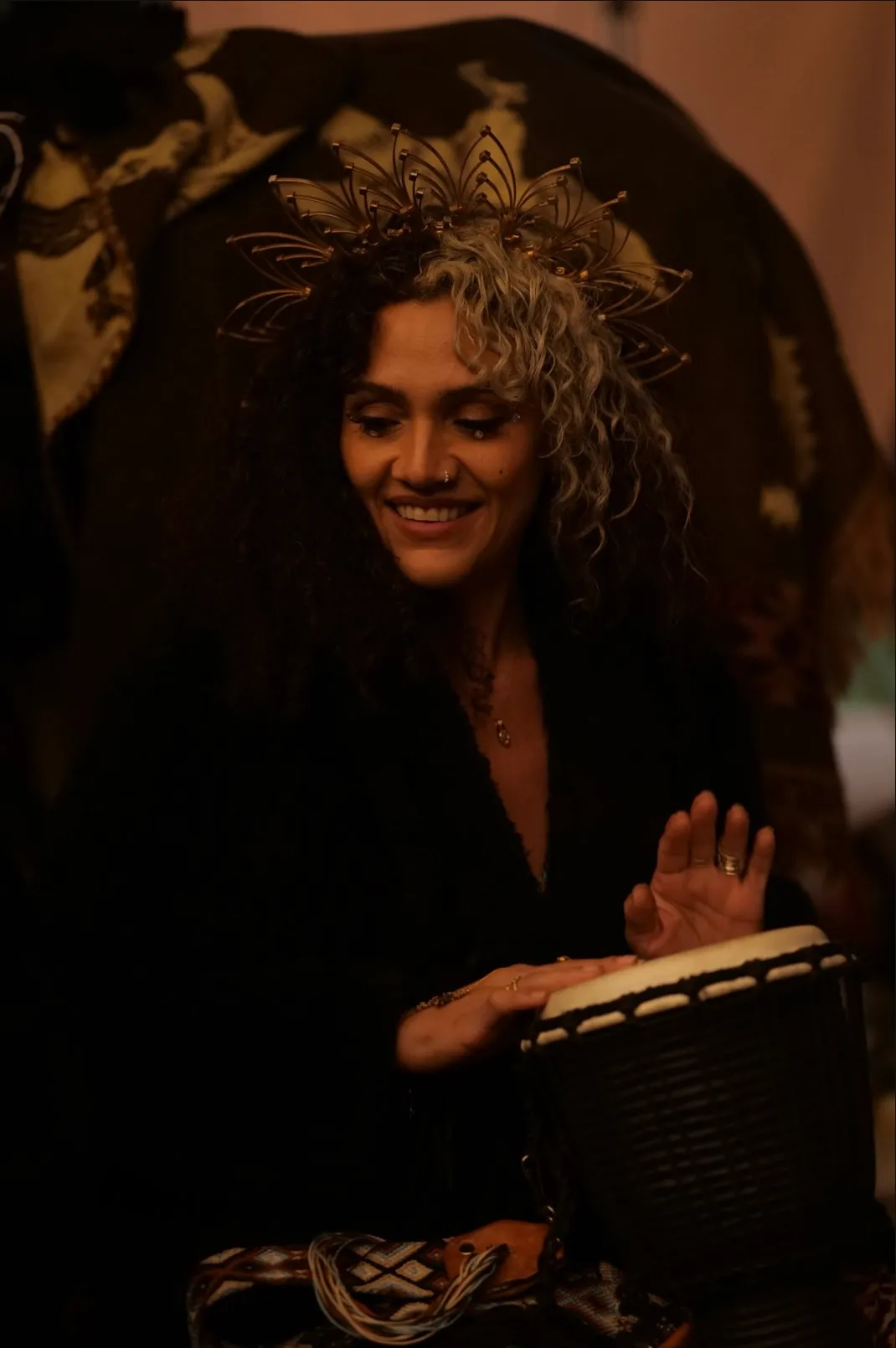 Luna Asé playing the drum